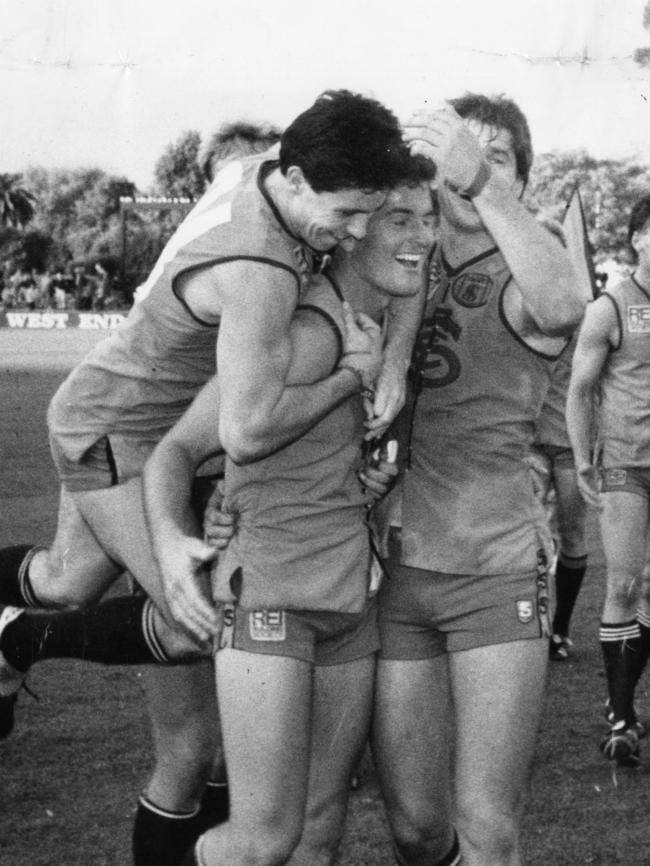 Shane Radbone with Sturt teammates David Wark and Tony McCarthy in 1990.