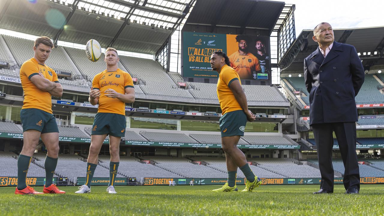 Head coach Eddie Jones with Andrew Kellaway, Reece Hodge and Pone Fa'amausili at the MCG, which Jones says can remain a happy hunting ground for the Wallabies. Picture: Daniel Pockett / Getty Images