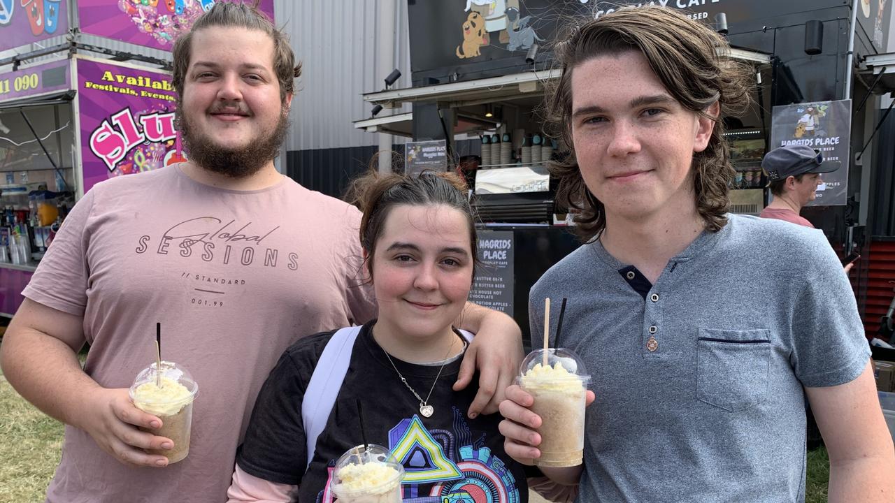 (From left to right) Jarred Howkins, Piper Brown and Hunter Brown enjoy a frozen butterbeer at the Mackay Show on Thursday, June 16. Picture: Duncan Evans