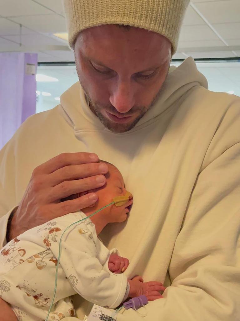 The sweet photo of Sam with his third child Harper. Picture: Instagram / @snezanwood