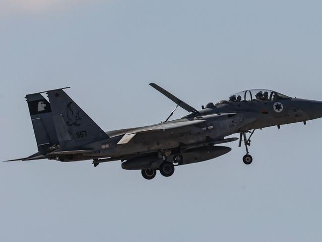 TOPSHOT - An Israeli fighter jet returning to base flies above an area near Tel Aviv on September 26, 2024. Israel's defence ministry said on September 26 that it had secured an $8.7 billion aid package from the United States to support the country's ongoing military efforts, including upgrading air defence systems. (Photo by GIL COHEN-MAGEN / AFP)