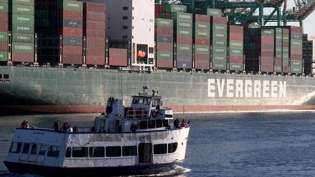 A tour boat passes a container ship at the Port of Los Angeles. Even if Americans wanted to, trying to reproduce the whole of electronics supply chains in the US, from raw materials to finished goods, would be extraordinarily difficult, if not impossible, says researcher Lauren Dudley. Picture: Getty Images / AFP