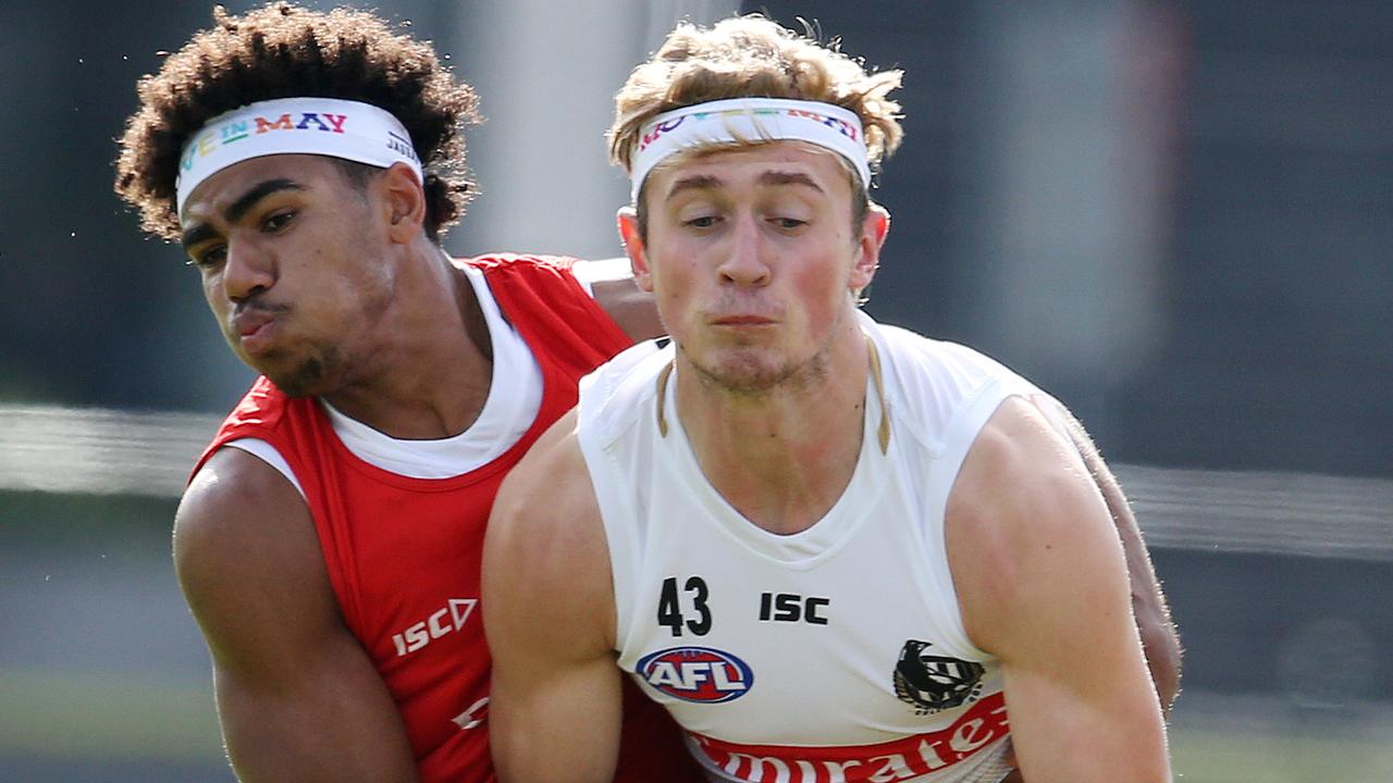 Anton Tohill is tackled by Isaac Quaynor during a Collingwood training session. Picture: Michael Klein