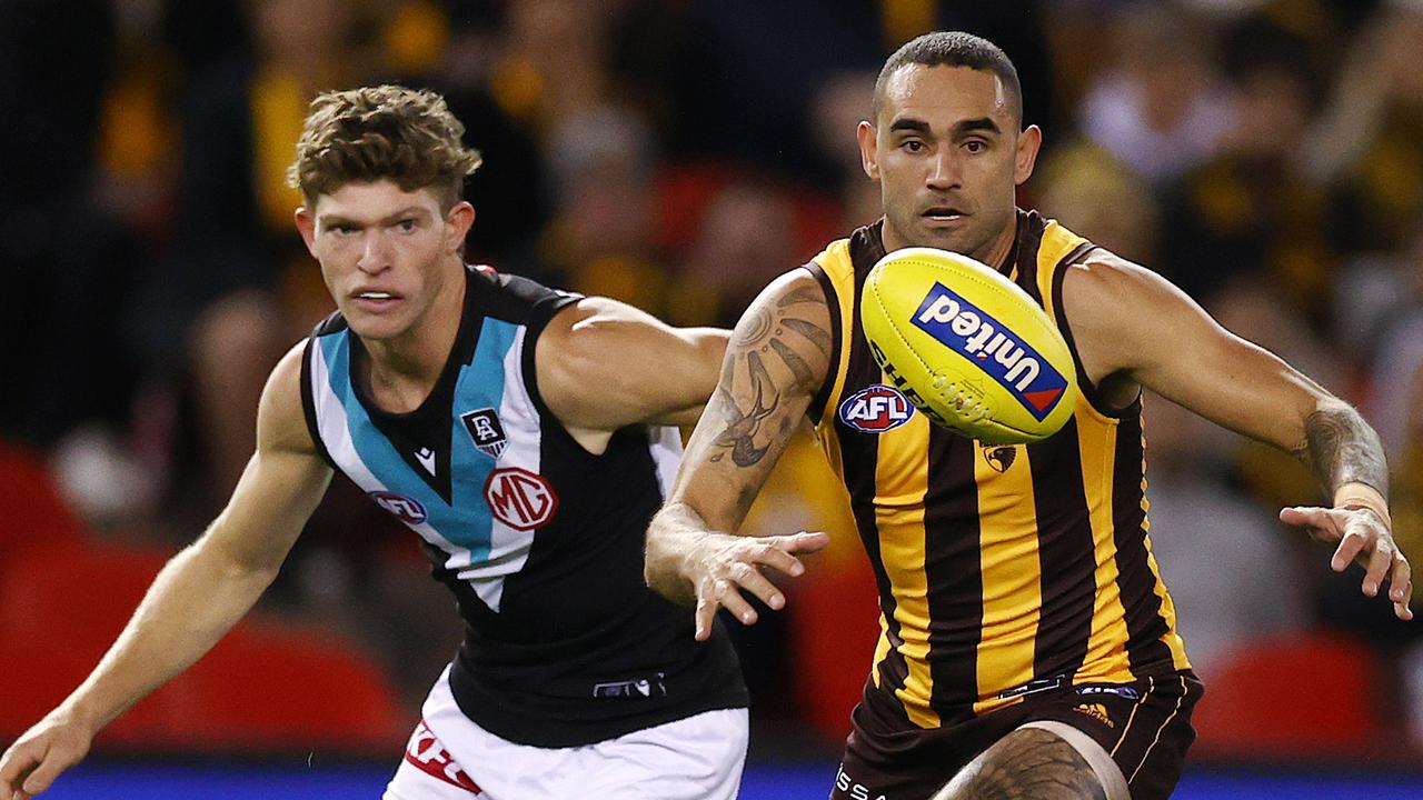 Burgoyne (R) made his AFL debut with Port Adelaide in 2002. Pic: Michael Klein