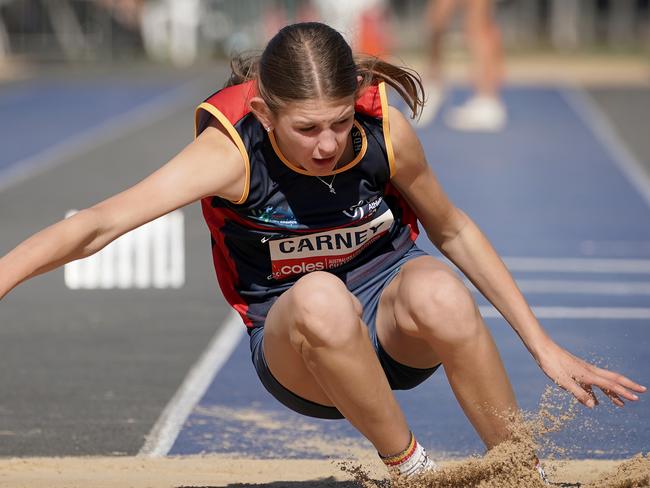 Ruby Carney competing in the triple jump.