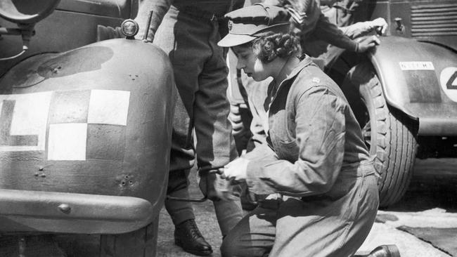 Princess Elizabeth learning basic car maintenance as a Second Subaltern in the A.T.S 12th April 1945. Picture: Daily Mirror