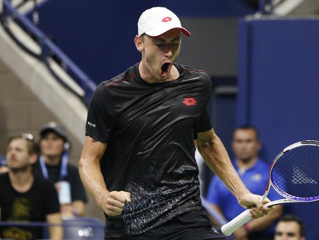 John Millman reacts after winning a point in his win over Roger Federer. Picture: AP