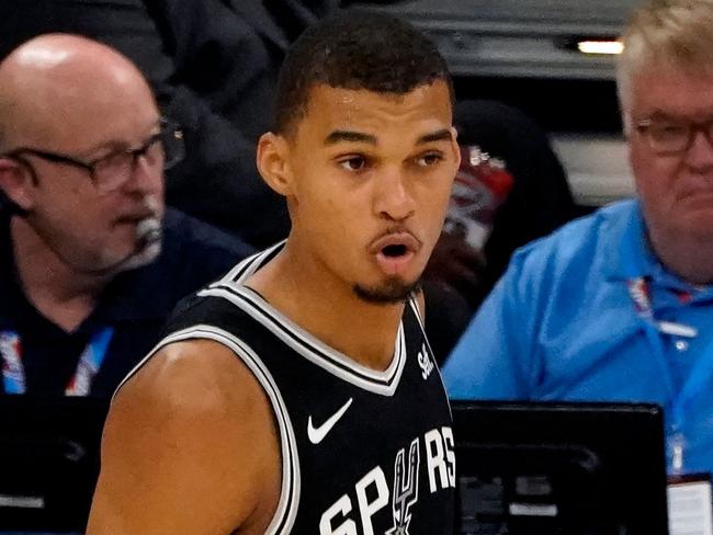 San Antonio Spurs French center #01 Victor Wembanyama looks on during the NBA pre-season basketball game between San Antonio Spurs and Oklahoma City Thunder at Paycom Center arena in Oklahoma City, Oklahoma, on October 9, 2023. (Photo by TIMOTHY A. CLARY / AFP)