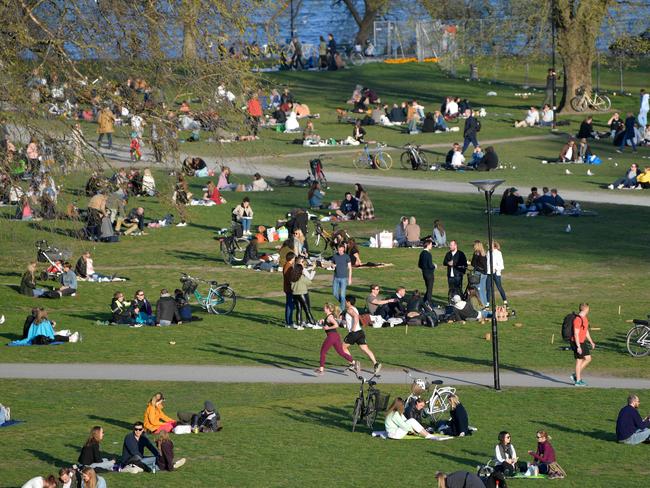 People enjoy warm weather in a Stockholm park. Picture: AFP.