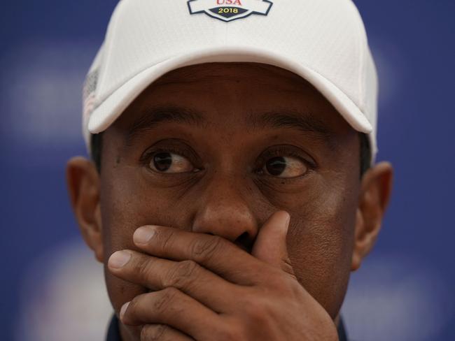 (FILES) In this file photo US golfer Tiger Woods addresses media representatives during a press conference ahead of the 42nd Ryder Cup at Le Golf National Course at Saint-Quentin-en-Yvelines, south-west of Paris on September 25, 2018. - Tiger Woods was hospitalized following a bad single-car accident in Los Angeles County on the morning of February 23, 2021, with officials requiring the jaws of life to free him from the vehicle. "On February 23, 2021, at approximately 7:12 am,  LASD responded to a single vehicle roll-over traffic collision on the border of Rolling Hills Estates and Rancho Palos Verdes," officials say. (Photo by Lionel BONAVENTURE / AFP)