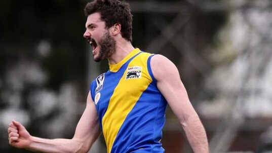 Jack Johnstone celebrates after knocking over a goal for Williamstown in a VFL final.