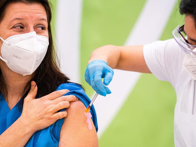 A health worker gets the Pfizer jab. Picture: AFP