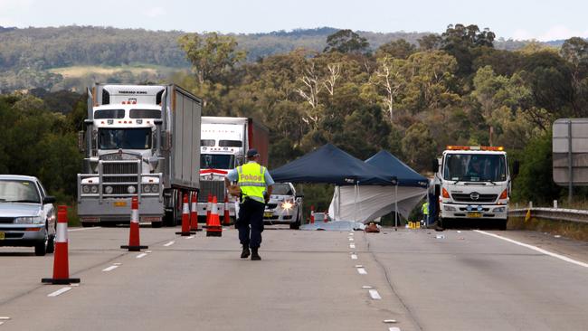 Police at the scene of a double fatality where motorist Sarah Frazer and tow truck driver Geoff Clark were killed when hit by a truck on the Hume Highway near Mittagong in Southern Highlands of NSW.