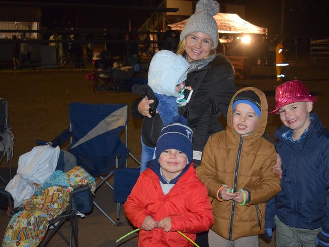 PUFFY JACKETS AND BEANIES: Everyone was rugged up on Saturday night at the Killarney Bonfire. Katrina Thomson with six month old Austin Thomson and Darcy Thomson 4, Hugo Hofmeier 7 and Charlie Thomson