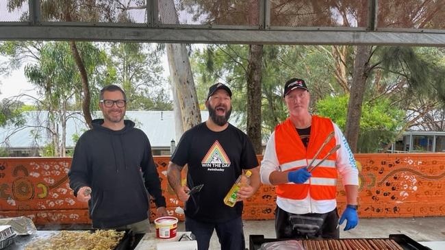 Scott Clements, Michael Darman and Ian Hall whipping up democracy sausages at Queanbeyan south public school in the seat of Monaro. Picture: Julia Kanapathippillai