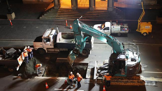 Work in Macquarie Street Hobart on the hole that will house the chamber for performance artist Mike Parr. Picture: NIKKI DAVIS-JONES