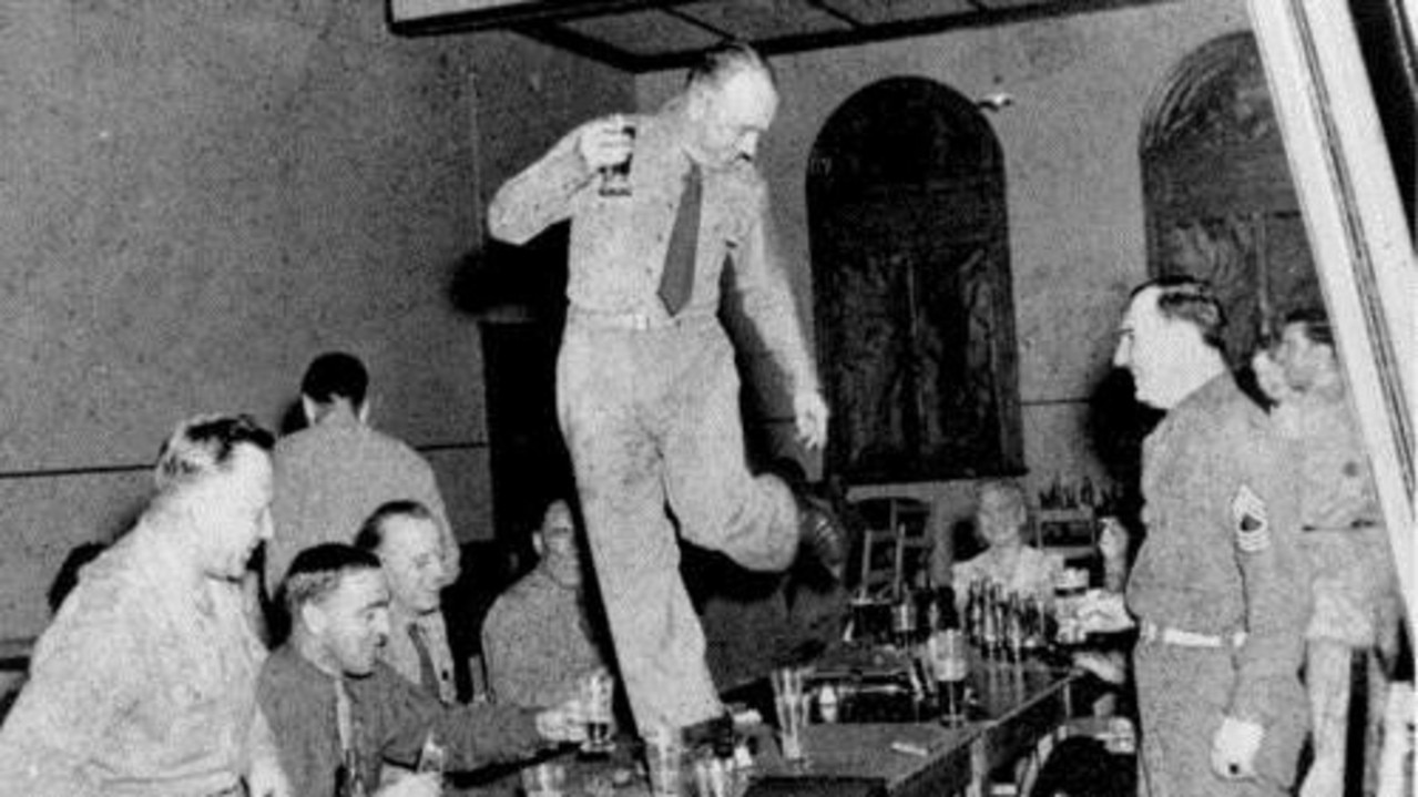 An American soldier dancing on a table at Eagle Farm World War II.