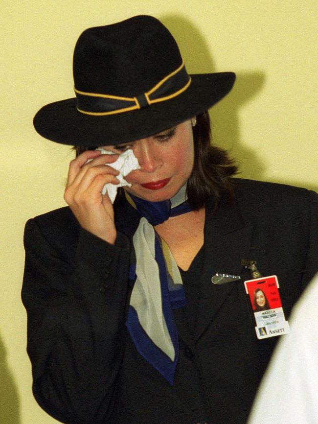 Flight attendant Marilla Watson wipes tears from her eyes on the last day of Ansett flights out of Melbourne.