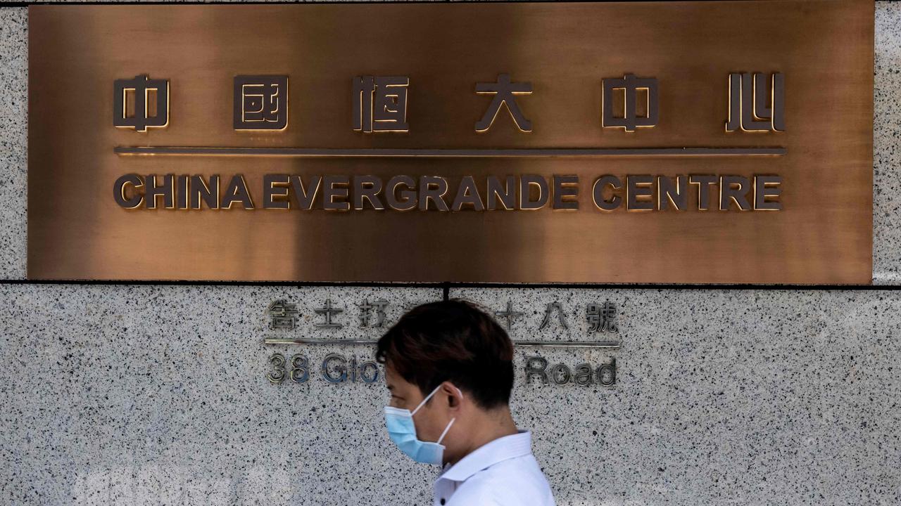 A man walks past the China Evergrande Centre in Hong Kong. Picture: Isaac Lawrence / AFP