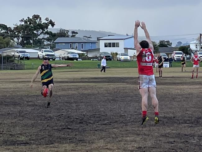 Dromana captain Billy Quigley kicks the sealer.