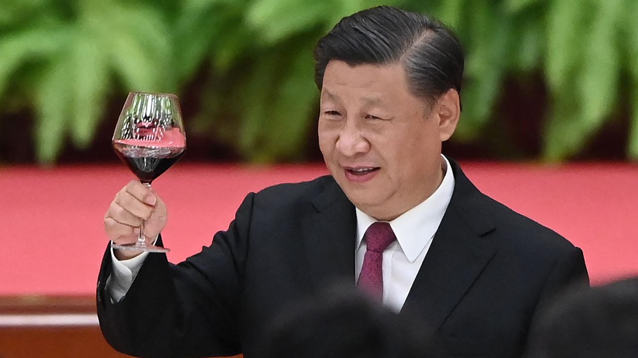 Chinese President Xi Jinping raising his glass of red wine that presumably isn’t Australian. Picture: GREG BAKER / AFP.