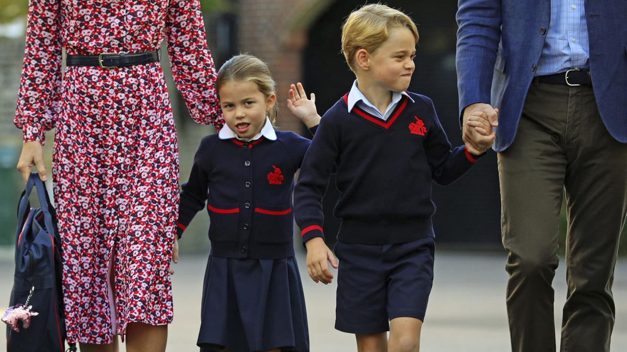 The pint-sized princess waved when she spotted photographers. Picture: AP.