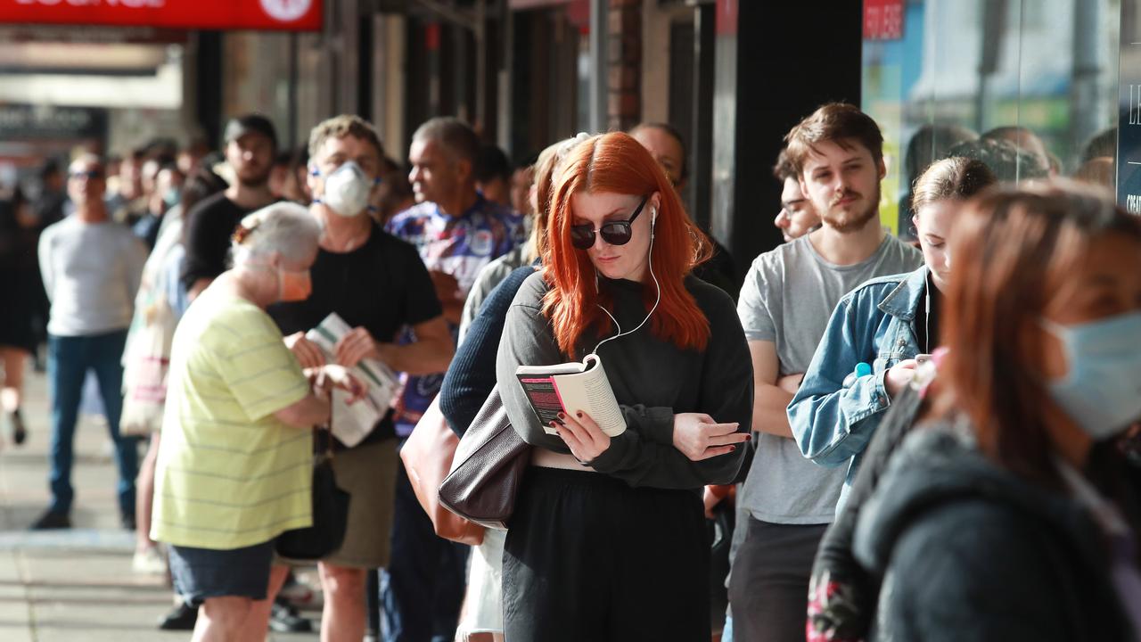 People queue at Centrelink at Marrickville, Sydney in March. Picture: John Feder