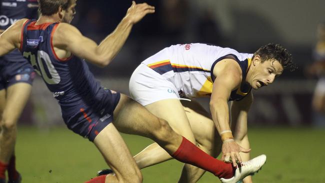 Adelaide’s Josh Jenkins and Norwood’s Brady Dawe. Picture: Dean Martin