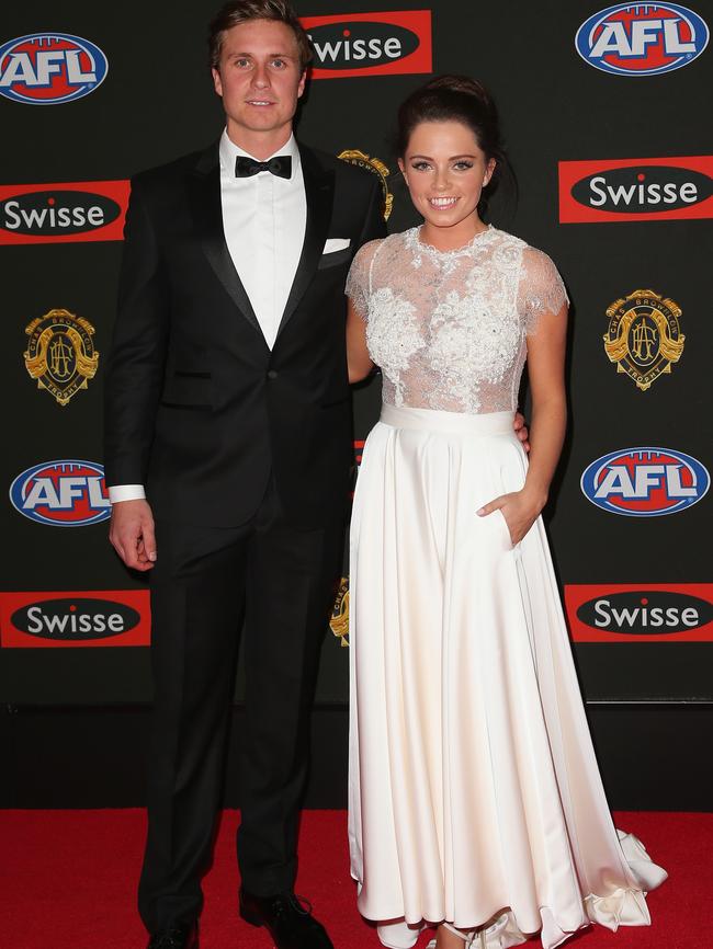 Mitch Duncan of the Geelong Cats and his partner Demi Miles.