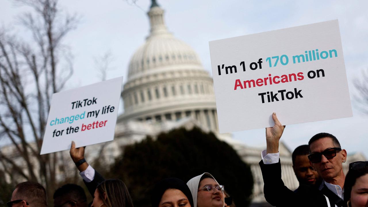 Participants hold signs in support of TikTok outside the US Capitol Building on March 13. (Photo by Anna Moneymaker / GETTY IMAGES NORTH AMERICA / Getty Images via AFP)