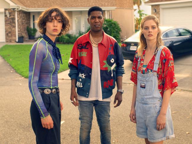 Bill and Ted's daughters (played by Brigette Lundy-Paine, left, and Samara Weaving) recruit a backup band for the dads which includes Kid Cudi (centre).