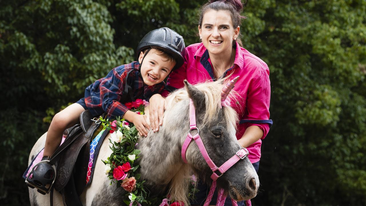 Pony Parties Toowoomba owner Lauren Sykes takes her son Josiah Sykes for a pony ride on Cookie. Picture: Kevin Farmer