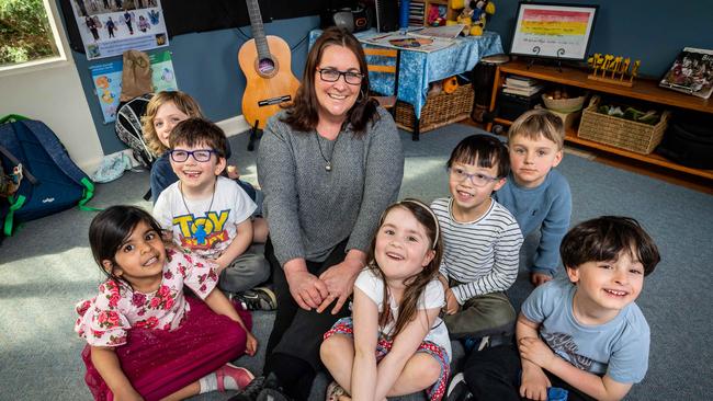 Childcare educator Leanne Mits joined by students Picture: Jake Nowakowski