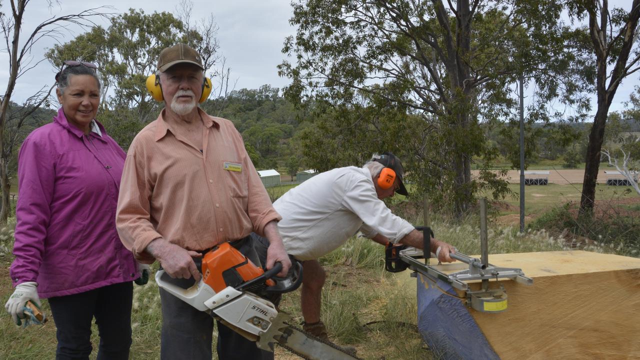 Toowoomba and District Woodcrafters (from left) Ez Bay, Ron Dangerfield and Kerry Smith cutting slabs that are sold to fund their charitable activities. This endeavour has been put on hold after thieves stole the club’s generator.