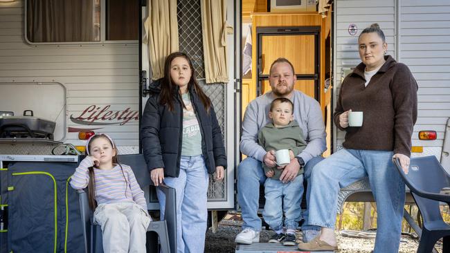 Jarrad and Caitlin Brown with their children Zara 11yrs, Harlow 7yrs and Harvey 3yrs who are living in a caravan as their home is completed. Picture: Emma Brasier