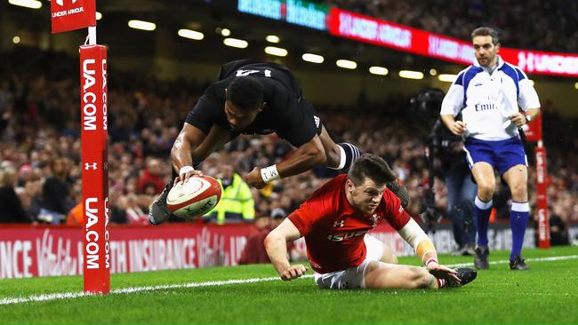 Waisake Naholo of New Zealand touches down for the first try against Wales.
