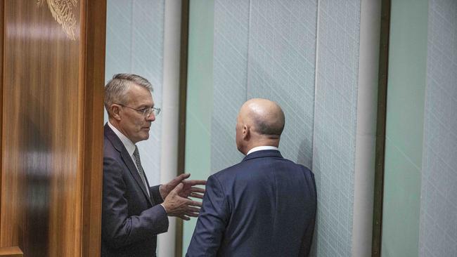 Attorney-General Mark Dreyfus speaks with Opposition Leader Peter Dutton behind the speakers chair in Question Time. Picture: NCA NewsWire / Gary Ramage