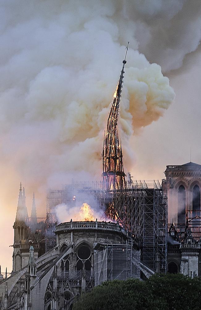Flames and smoke rise as the spire on Notre Dame cathedral collapses in Paris, Monday, April 15, 2019. (AP Photo/Diana Ayanna)