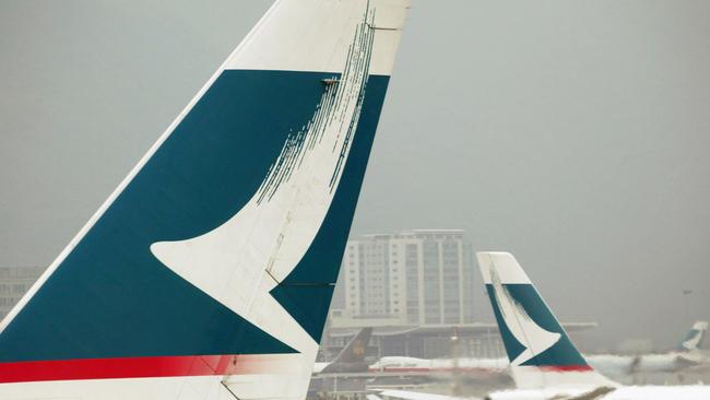 Cathay Pacific aeroplanes stand on the tarmac in Hong Kong.