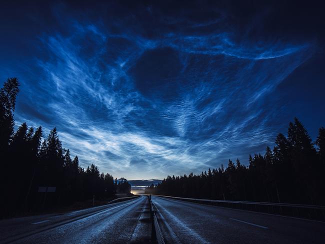 Insight Astronomy Photographer of the Year 2017 shortlist selection: The Road Back Home. Picture:Ruslan Merzlyakov (Latvia) Noctilucent clouds stretch across the Swedish sky illuminating a motorcyclist’s ride home in this dramatic display. Noctilucent clouds are the highest clouds in the Earth’s atmosphere and form above 200,000 ft. Thought to be formed of ice crystals, the clouds occasionally become visible at twilight when the Sun is below the horizon and illuminates them. Near Umeå, Sweden, 8 August 2016