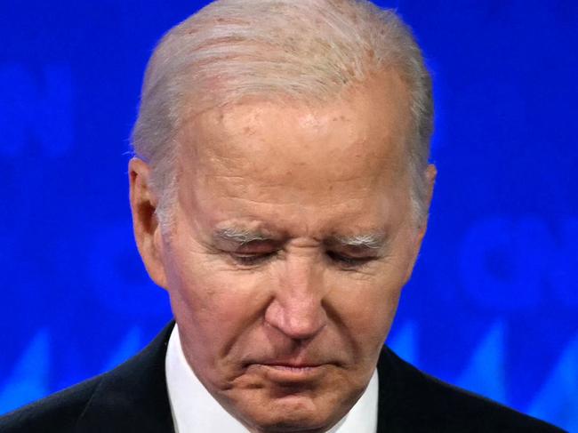 TOPSHOT - US President Joe Biden looks down as he participates in the first presidential debate of the 2024 elections with former US President and Republican presidential candidate Donald Trump at CNN's studios in Atlanta, Georgia, on June 27, 2024. (Photo by ANDREW CABALLERO-REYNOLDS / AFP)