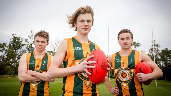 St Patrick's College football players, from left, vice-captain Alex Blackaby, 17, co-captain Bailey Gillow, 17, and Oliver Sanders, 18. Picture: PATRICK GEE