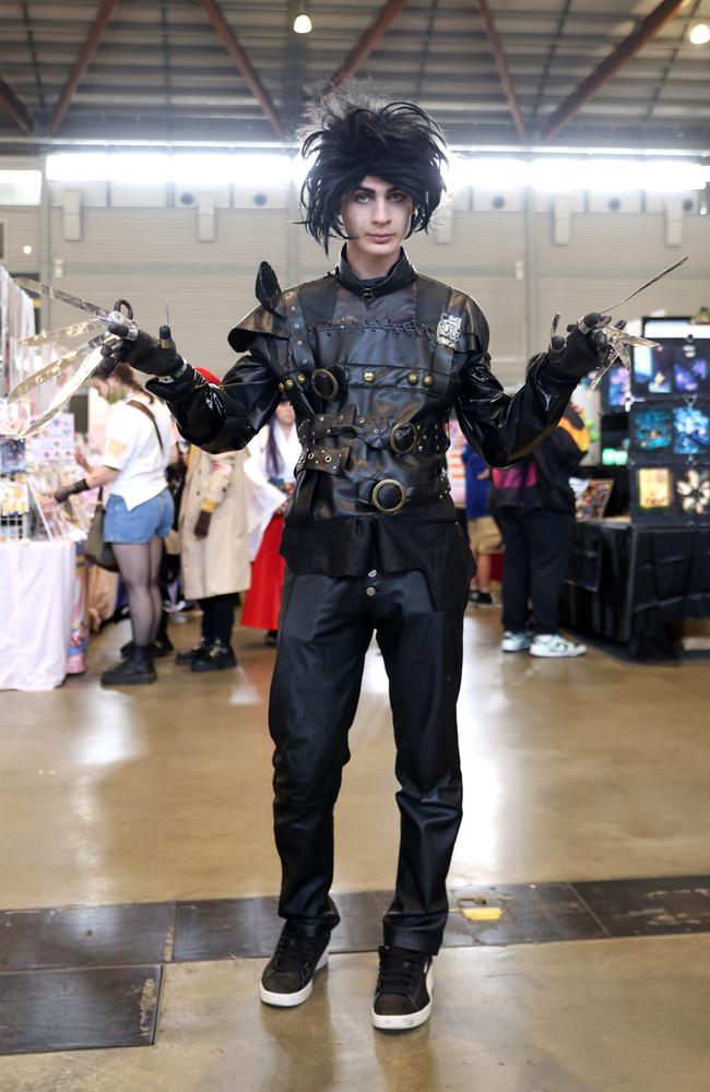 While usually people visiting the showground would be prevented from arriving with a fist full of blades, Edward Scissorhands had no trouble as he made his way through the convention. Picture: NewsWire / Damian Shaw