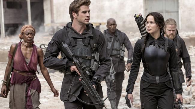 Ali (at rear) as Boggs, backing up Hunger Games heroes Luke Hemsworth and Jennifer Lawrence in Mockingjay — Part 1. Picture: Roadshow