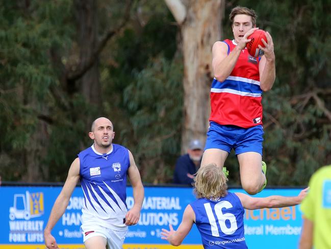 South Croydon footballer Max King flies for a mark in the Eastern Football League (EFL). Picture: Steve Bibby