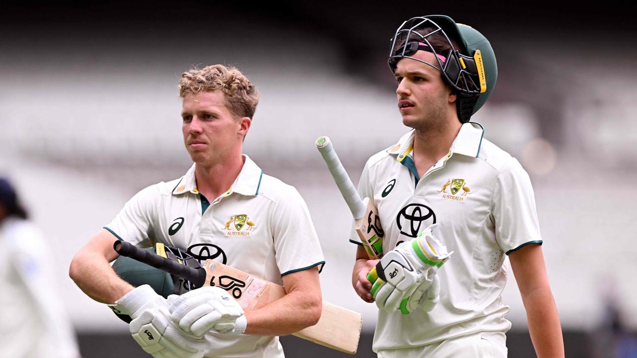 Australian batsmen Nathan McSweeney (L) and Sam Konstas (R) walk off. Photo by William WEST / AFP.