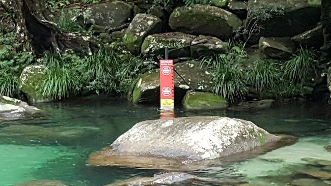 Queensland Parks and Wildlife services in 2019 installed warning signs at Josephine Falls, north of Innisfail, which indicate to swimmers when it is safe to swim, when to exercise caution and when to stay out of the water at the popular swimming hole. The installation of the warning signs came one month after a coronial inquest into two deaths at the waterfall recommended a warning system be installed. Picture: Brendan Radke