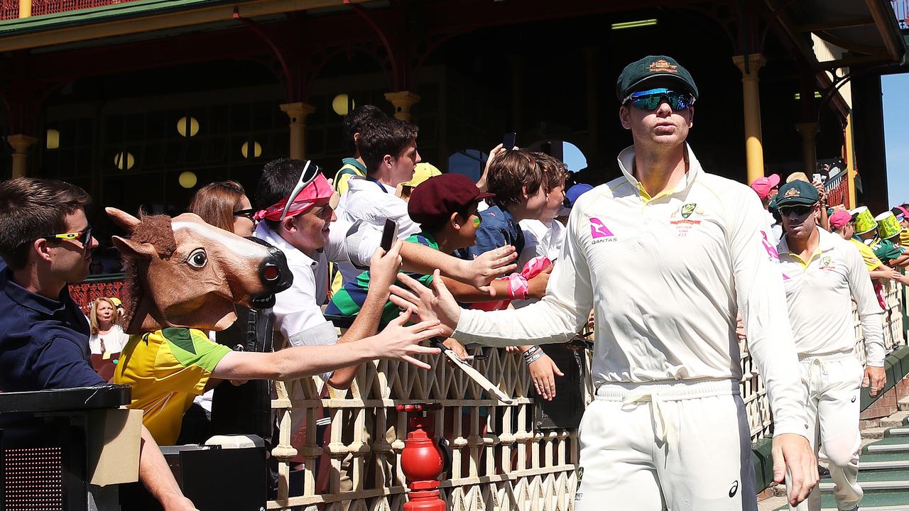 Steve Smith leads Australia onto the field as captain.