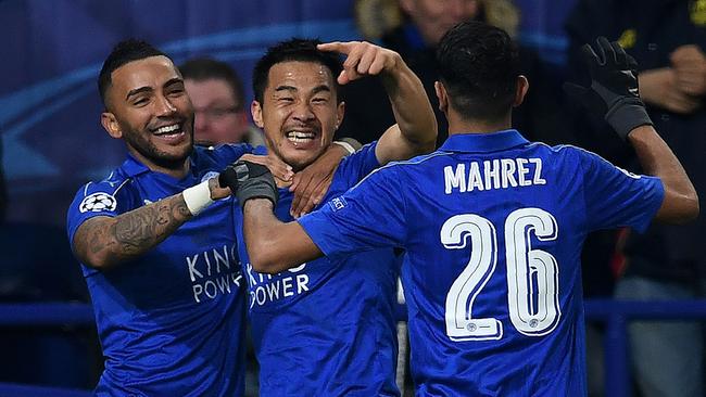 Leicester City's Japanese striker Shinji Okazaki (C) celebrates scoring.