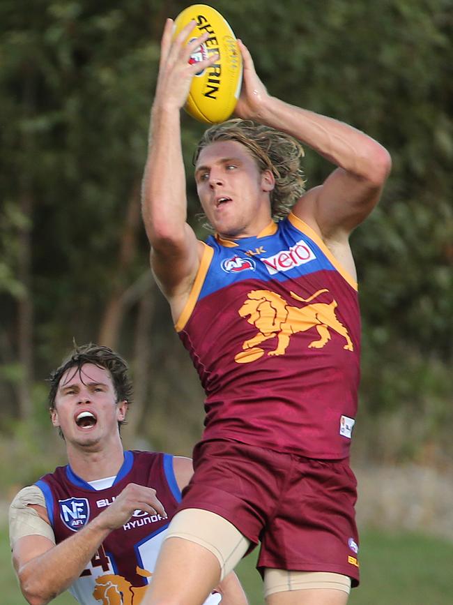 Tom Bell brings down a mark during a Brisbane intraclub match. Picture: Jono Searle